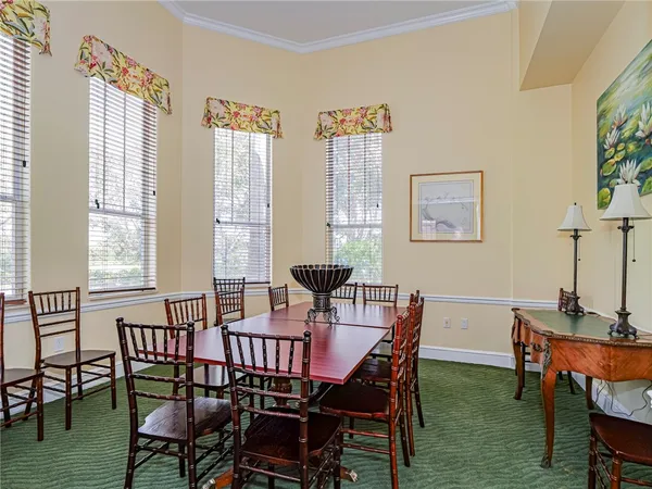a view of a dining room with furniture window and outside view