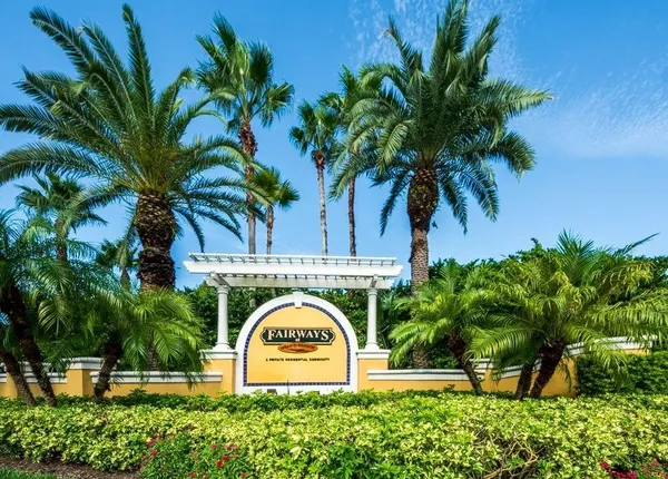 a view of front door of house with a garden