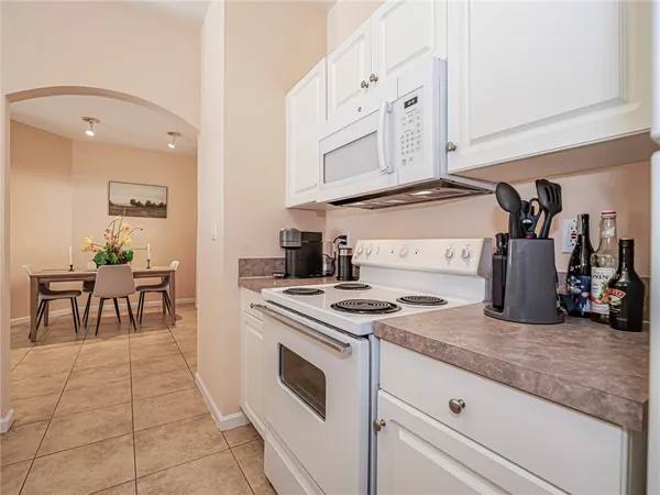 a kitchen with stainless steel appliances granite countertop a stove and a sink