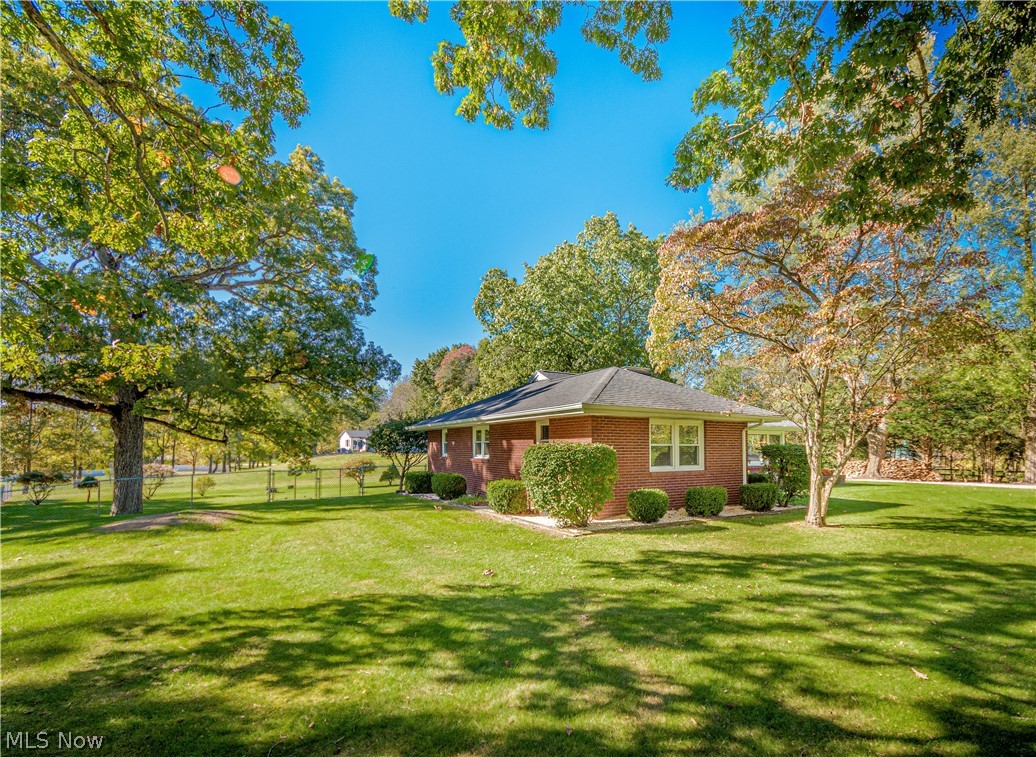 6770 Manchester Road Clinton, OH 44216 - Photo 2 of 33 Almost an acre, with about half an acre fenced in with access from the garage or breezeway.