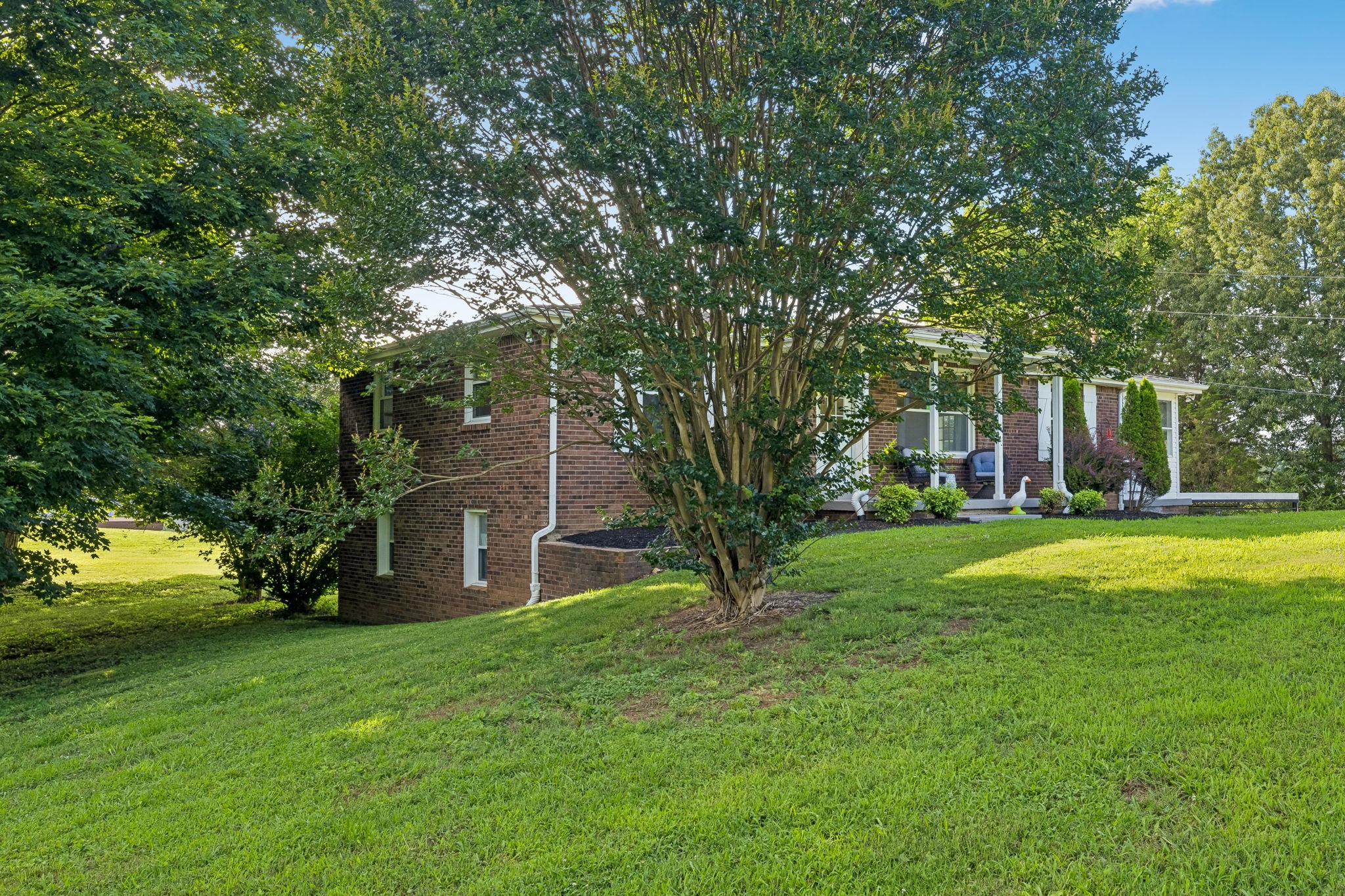 1326 Shahan Road Pleasant View, TN 37146 - Photo 41 of 41 a view of a house with a yard