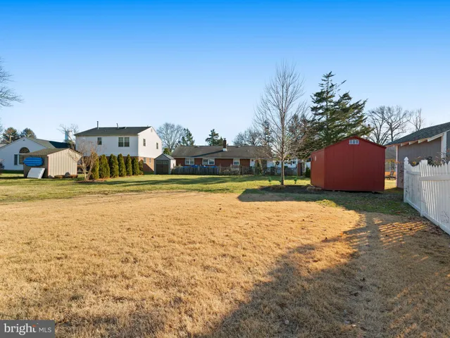 a house with swimming pool in front of it