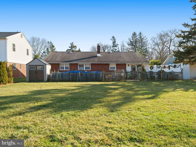 a front view of a house with a swimming pool