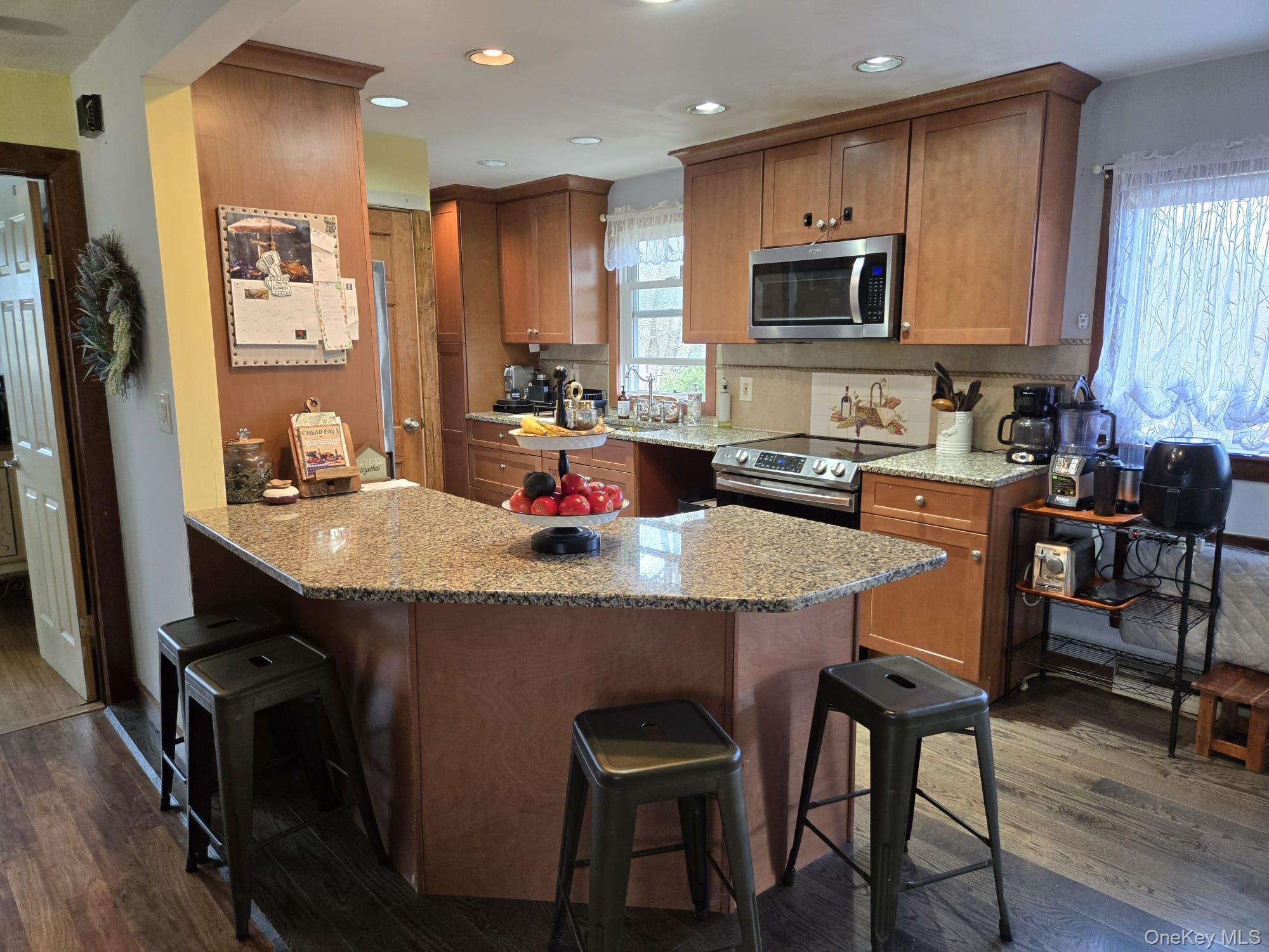 14 Lowell Road Carmel, NY 10512 - Photo 7 of 24 Kitchen with granite counter and stainless steel appliances.
