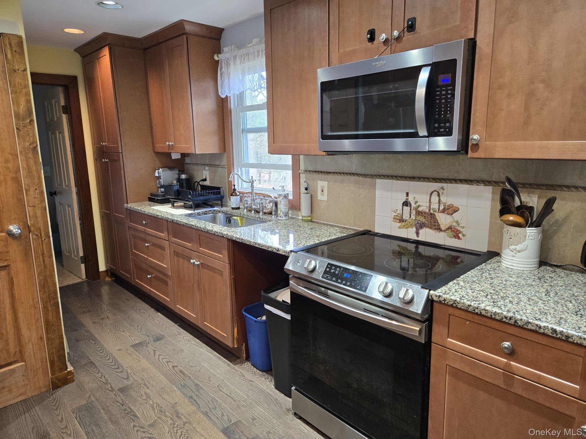 14 Lowell Road Carmel, NY 10512 - Photo 8 of 24 Kitchen with granite counter and stainless steel appliances.