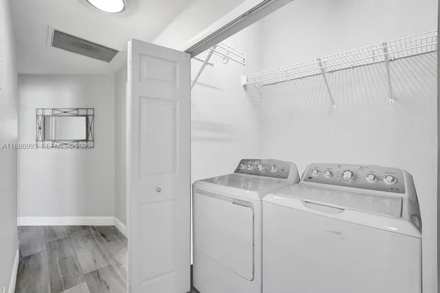 a utility room with dryer and washer