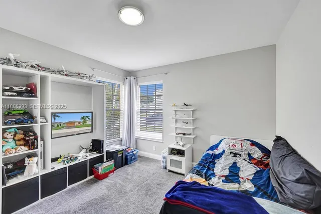 a view of a livingroom with furniture and toys