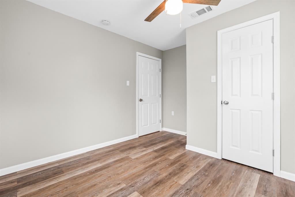 1210 Southey Street Waco, TX 76704 - Photo 16 of 29 an empty room with wooden floor
