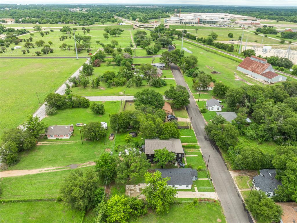 1210 Southey Street Waco, TX 76704 - Photo 23 of 29 an aerial view of green landscape with trees houses and lake view