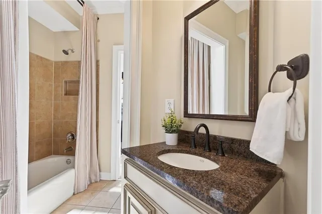 a kitchen with stainless steel appliances granite countertop a stove top oven a sink dishwasher a dining table and chairs with wooden floor