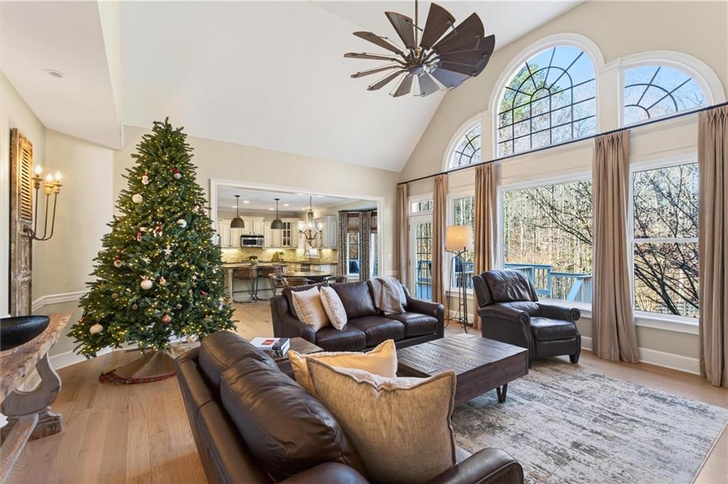 248 Cedarhurst Drive Canton, GA 30115 - Photo 24 of 76 a living room with furniture a chandelier and a large window