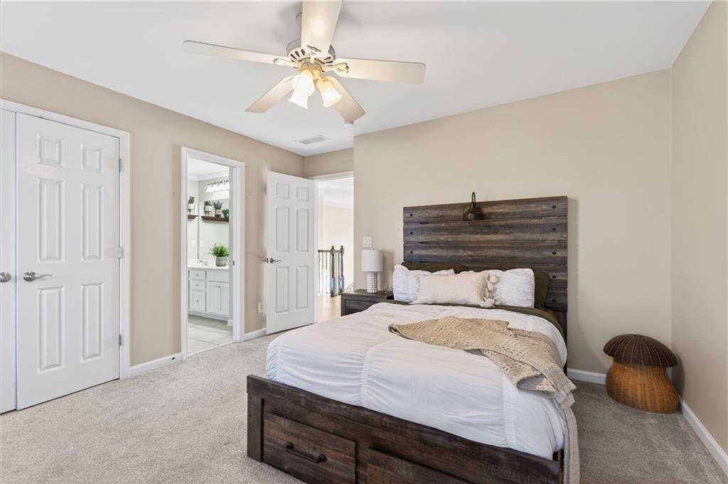 248 Cedarhurst Drive Canton, GA 30115 - Photo 28 of 76 a bedroom with a bed and a chandelier