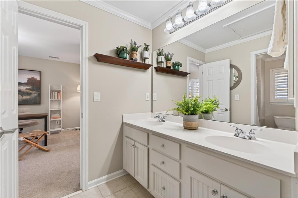 248 Cedarhurst Drive Canton, GA 30115 - Photo 30 of 76 a bathroom with a granite countertop sink a mirror and vanity
