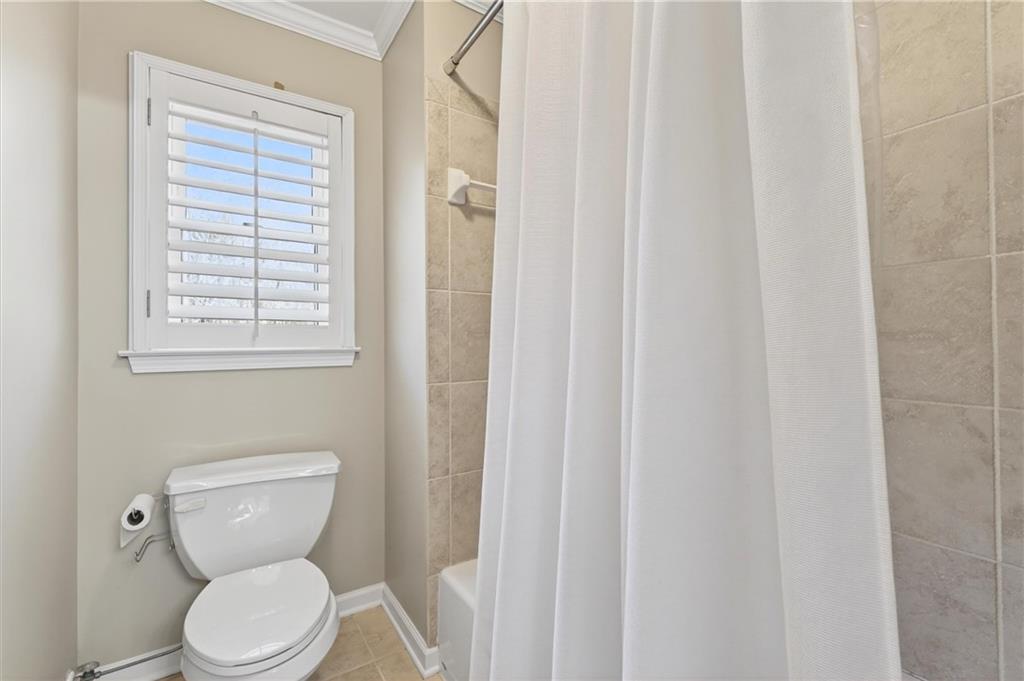 248 Cedarhurst Drive Canton, GA 30115 - Photo 31 of 76 a white toilet sitting next to a window