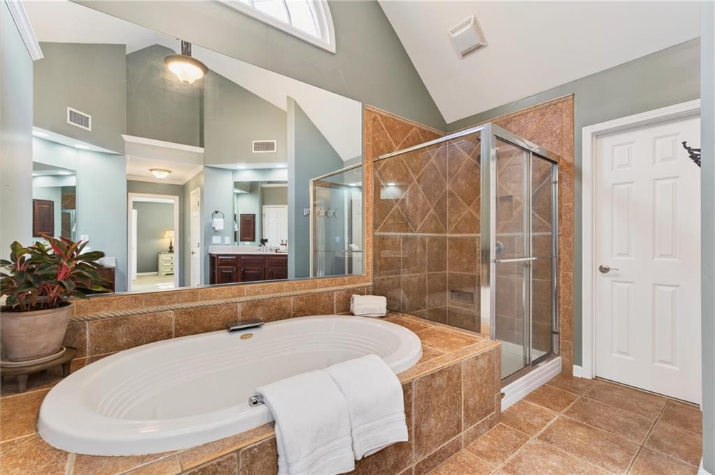 248 Cedarhurst Drive Canton, GA 30115 - Photo 40 of 76 a bathroom with a tub and shower