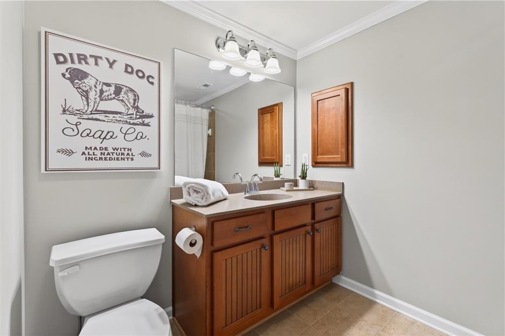 248 Cedarhurst Drive Canton, GA 30115 - Photo 44 of 76 a bathroom with a toilet sink and mirror