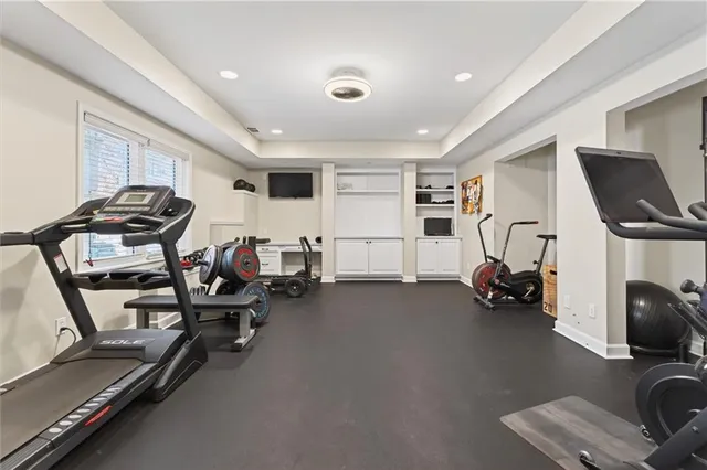an aerial view of a house with swimming pool and porch