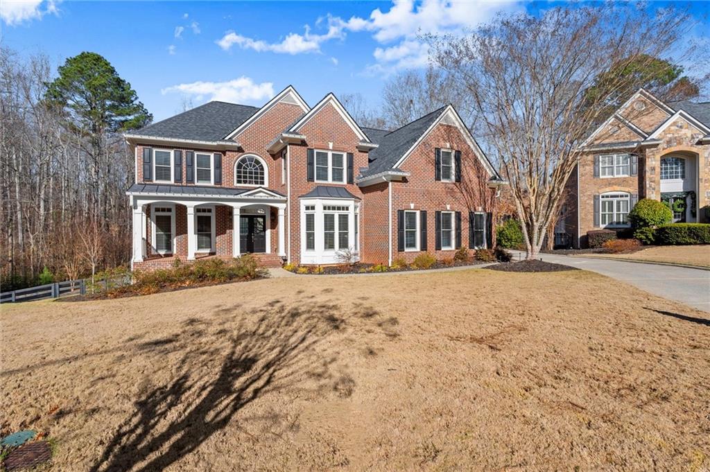248 Cedarhurst Drive Canton, GA 30115 - Photo 57 of 76 a front view of residential houses with yard and trees