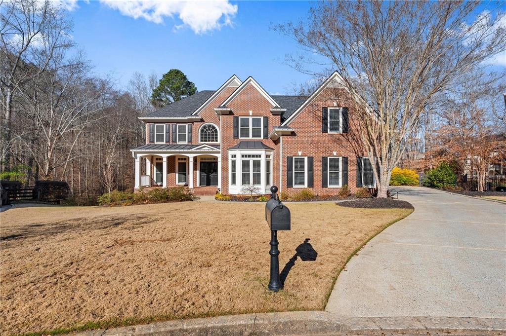 248 Cedarhurst Drive Canton, GA 30115 - Photo 58 of 76 a front view of a house with a yard