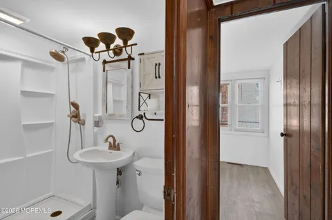 a bathroom with a sink and shower