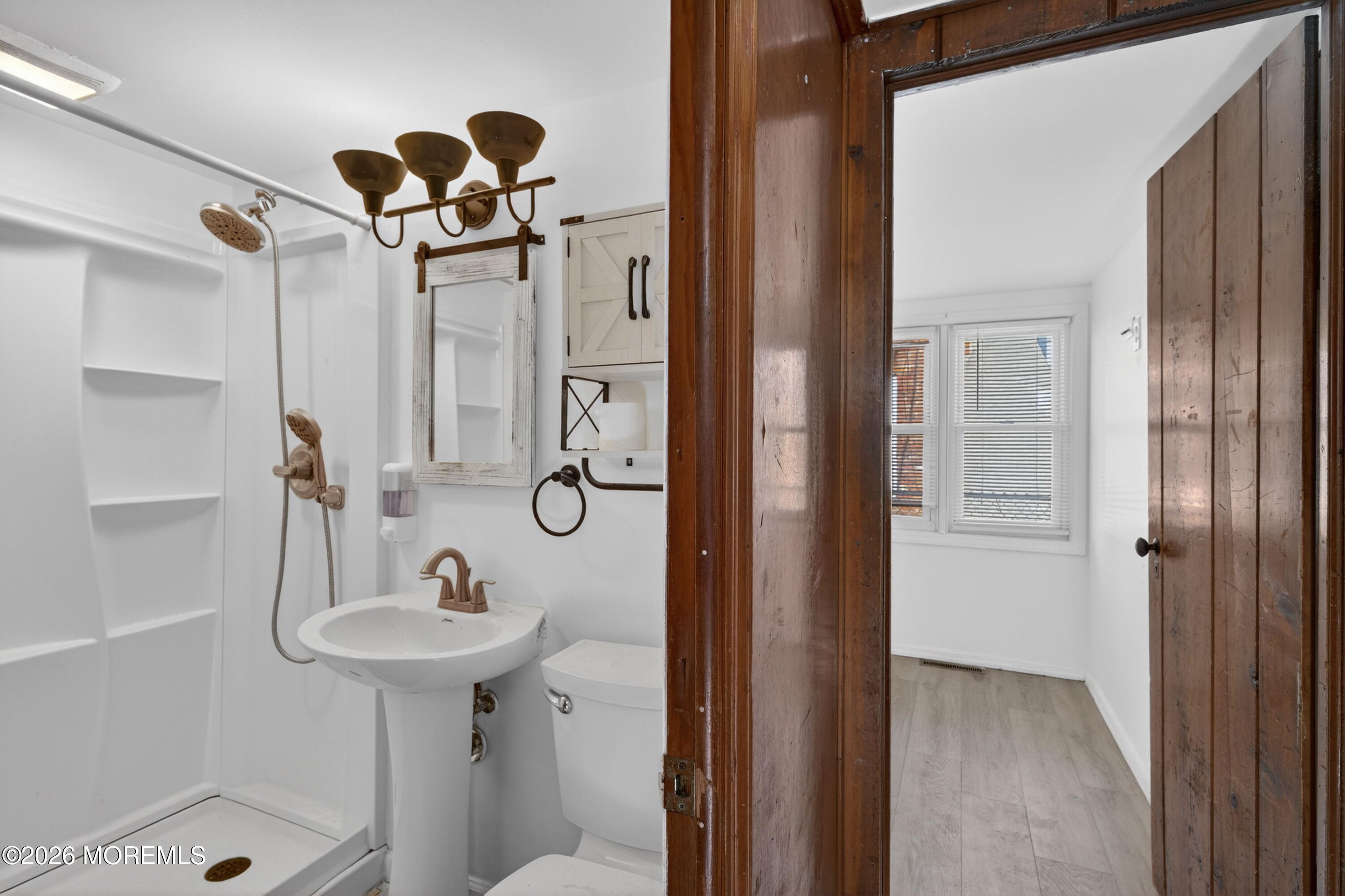 11 Cedar Road Brick, NJ 08723 - Photo 16 of 39 a bathroom with a sink and shower