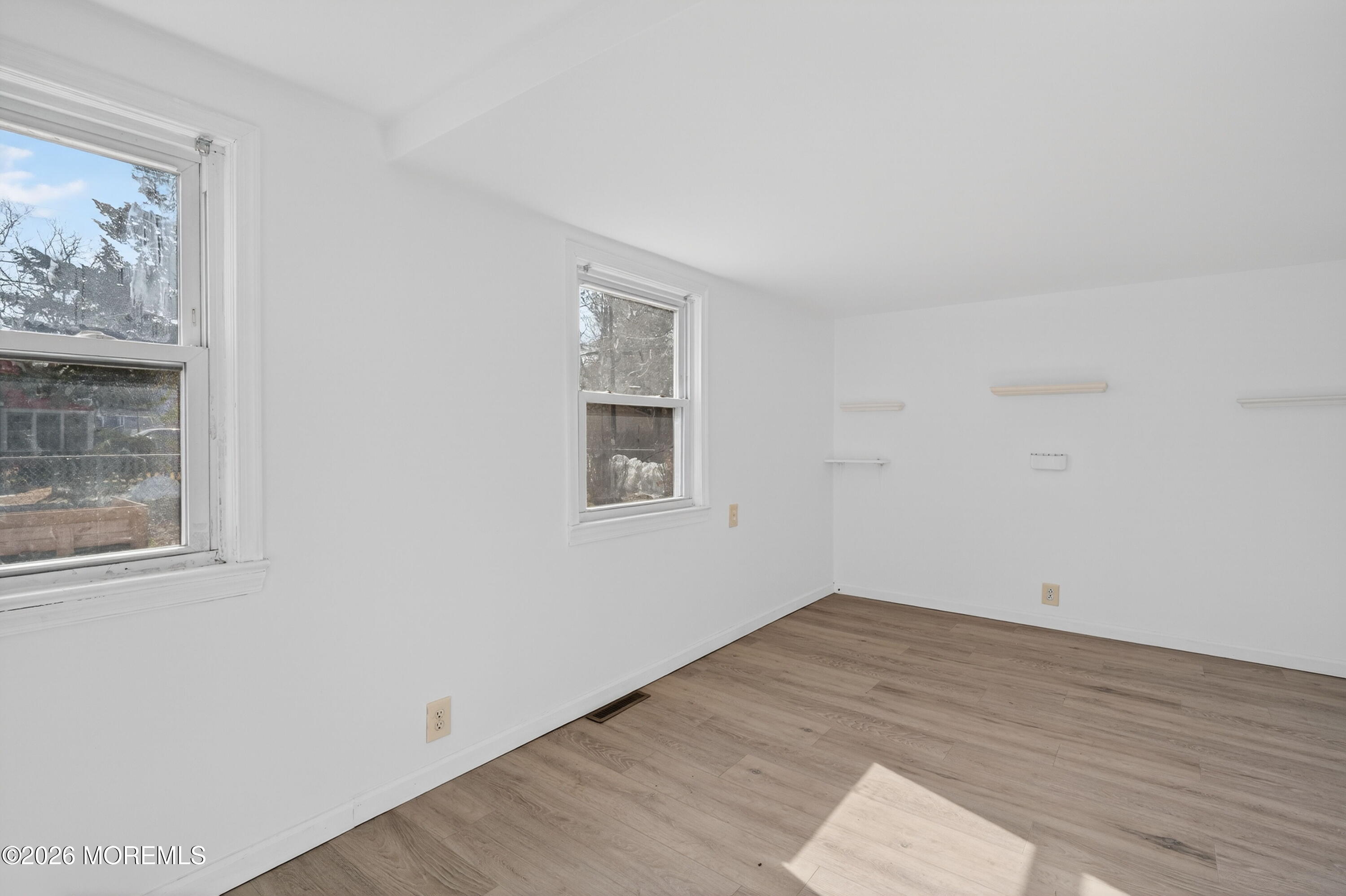 11 Cedar Road Brick, NJ 08723 - Photo 17 of 39 an empty room with wooden floor and window