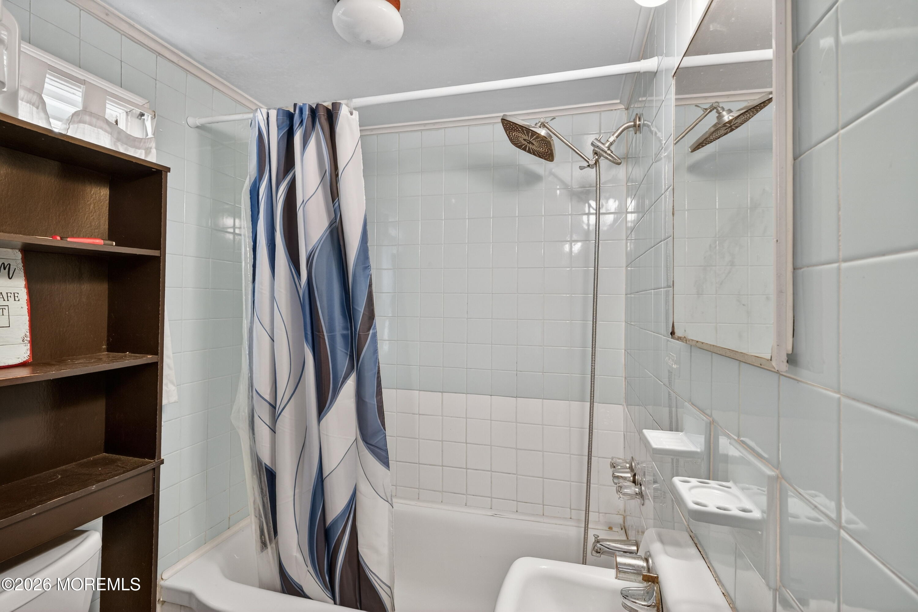 11 Cedar Road Brick, NJ 08723 - Photo 29 of 39 a bathroom with a bathtub and a shower