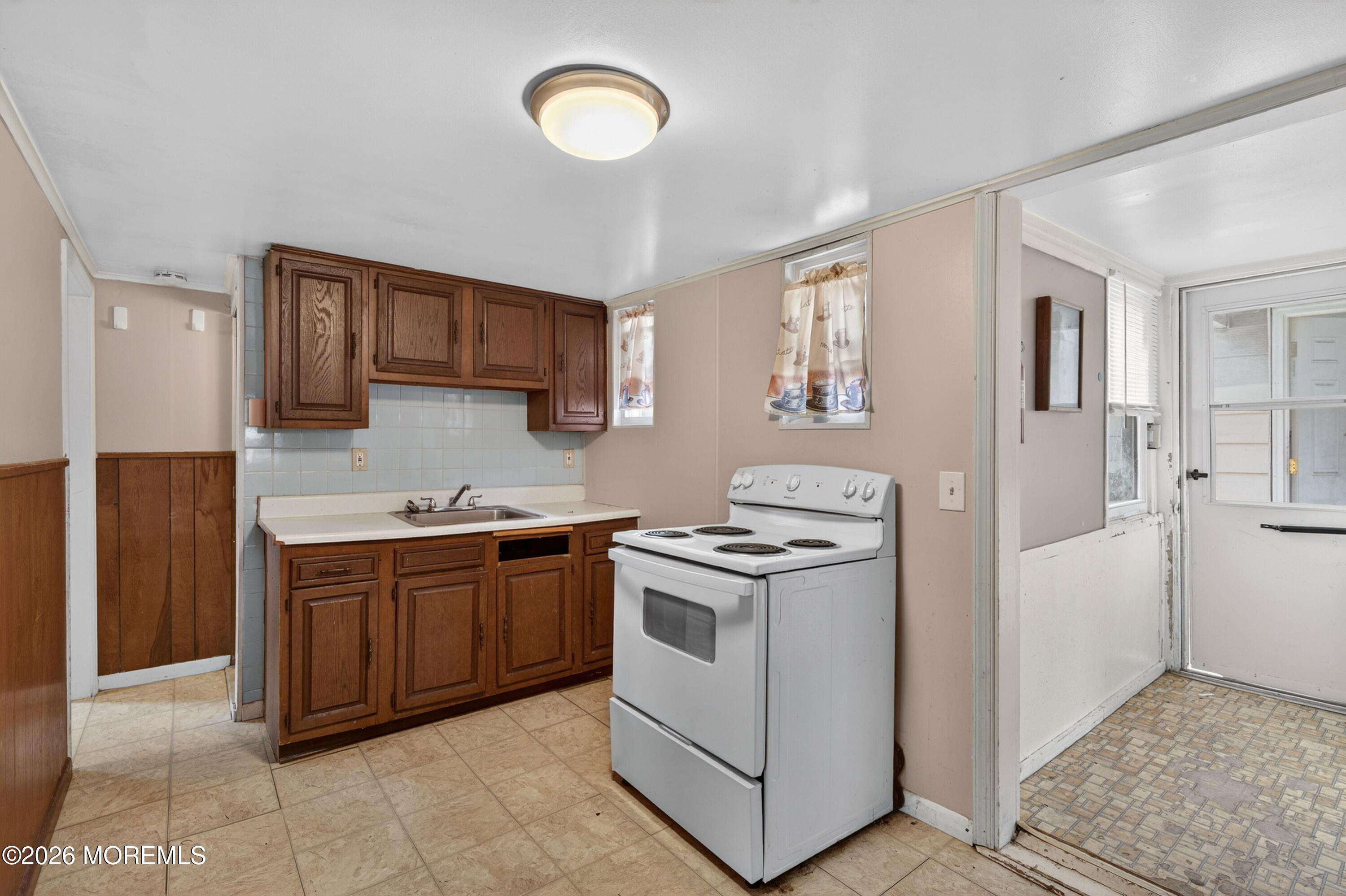 11 Cedar Road Brick, NJ 08723 - Photo 30 of 39 a kitchen with stainless steel appliances granite countertop a stove a sink and a refrigerator