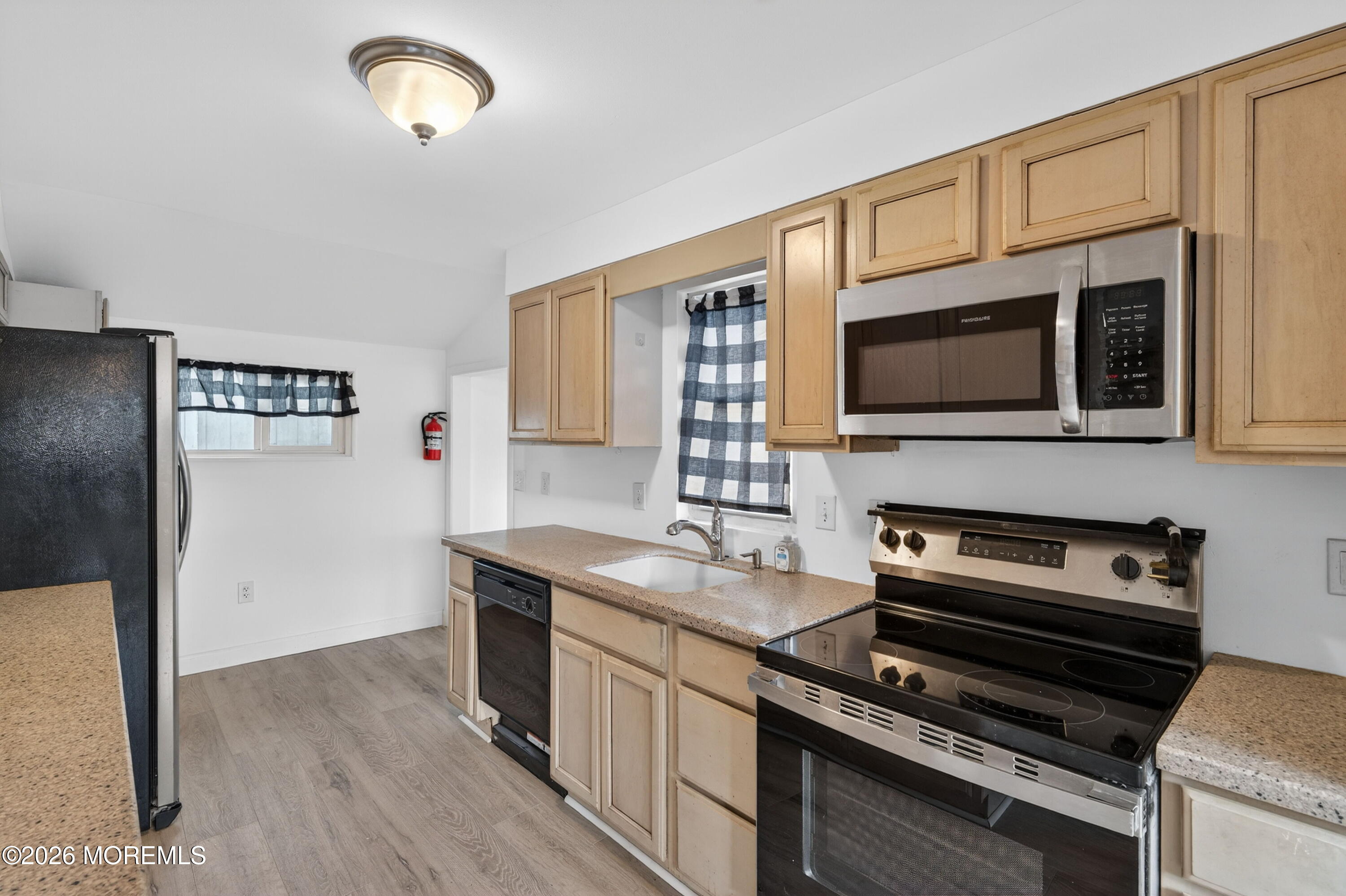 11 Cedar Road Brick, NJ 08723 - Photo 31 of 39 a kitchen with stainless steel appliances granite countertop a stove and a microwave