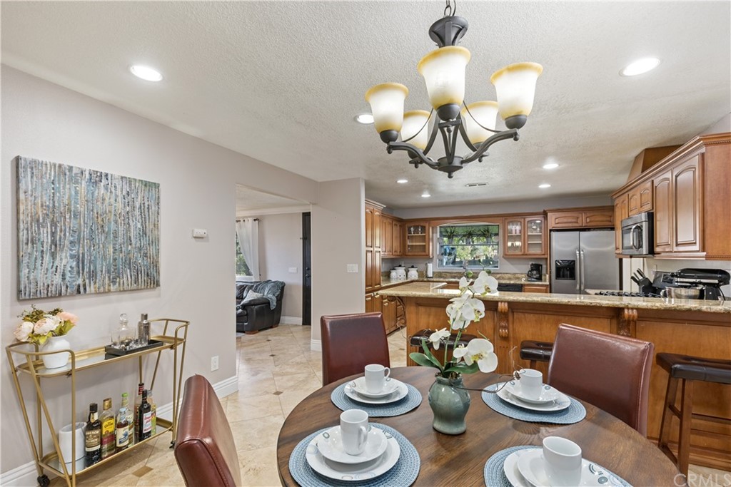 15141 Washington Street Riverside, CA 92506 - Photo 1 of 1 a large kitchen with a table and chairs