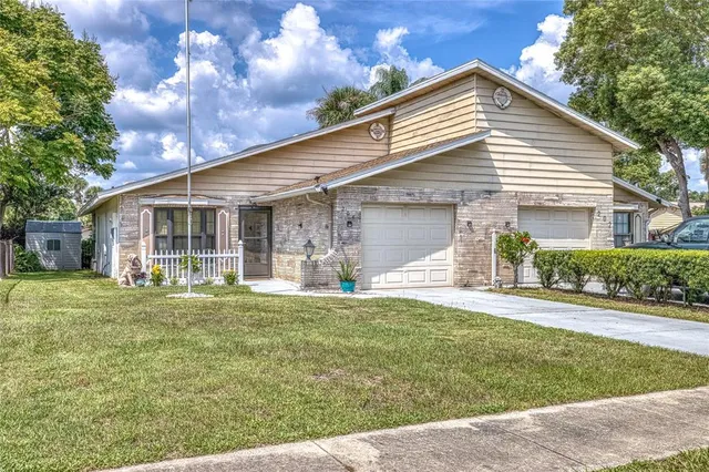 a front view of a house with a yard and porch