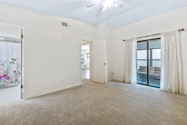 a bathroom with a sink mirror vanity and toilet