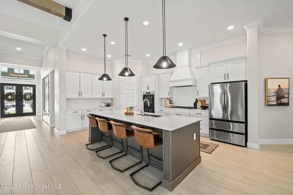a kitchen with stainless steel appliances a stove microwave and cabinets