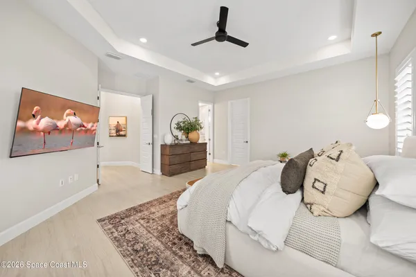 a white bath tub sitting in a bathroom next to a bathroom