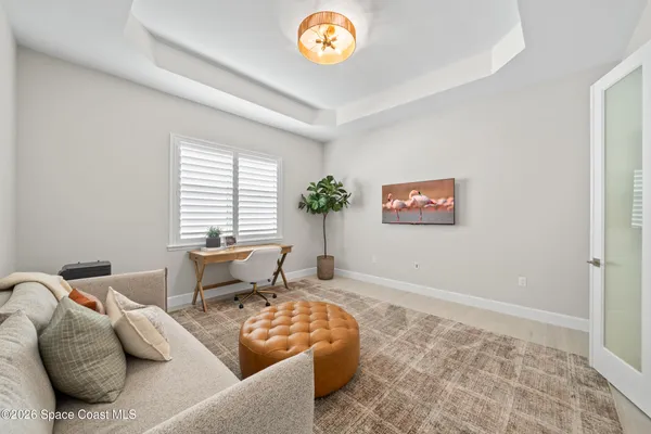 a bedroom with bed and a window