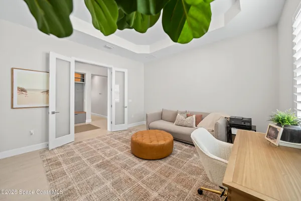 a bedroom with a bed and a couch