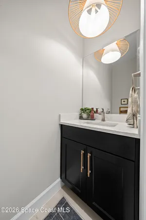 a sign that is sitting in front of flowers