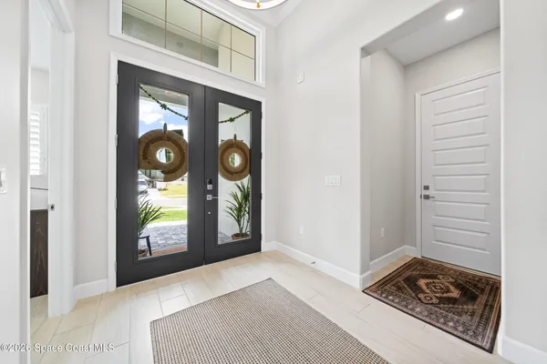 an aerial view of a house with a ocean view