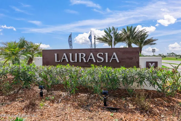 a view of a pool in a backyard