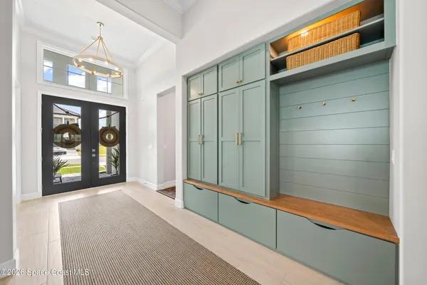 a living room with furniture ceiling fan and a rug