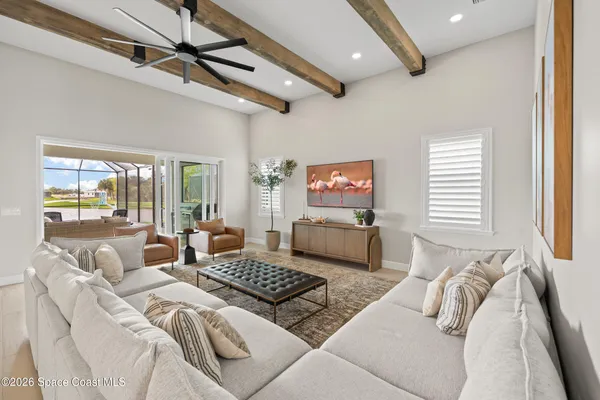 a kitchen with a sink window and cabinets