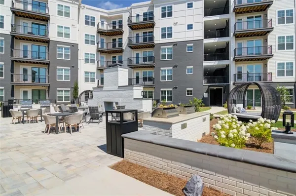 a view of swimming pool with outdoor seating
