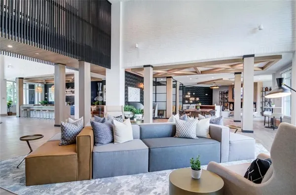 a living room with furniture and a table