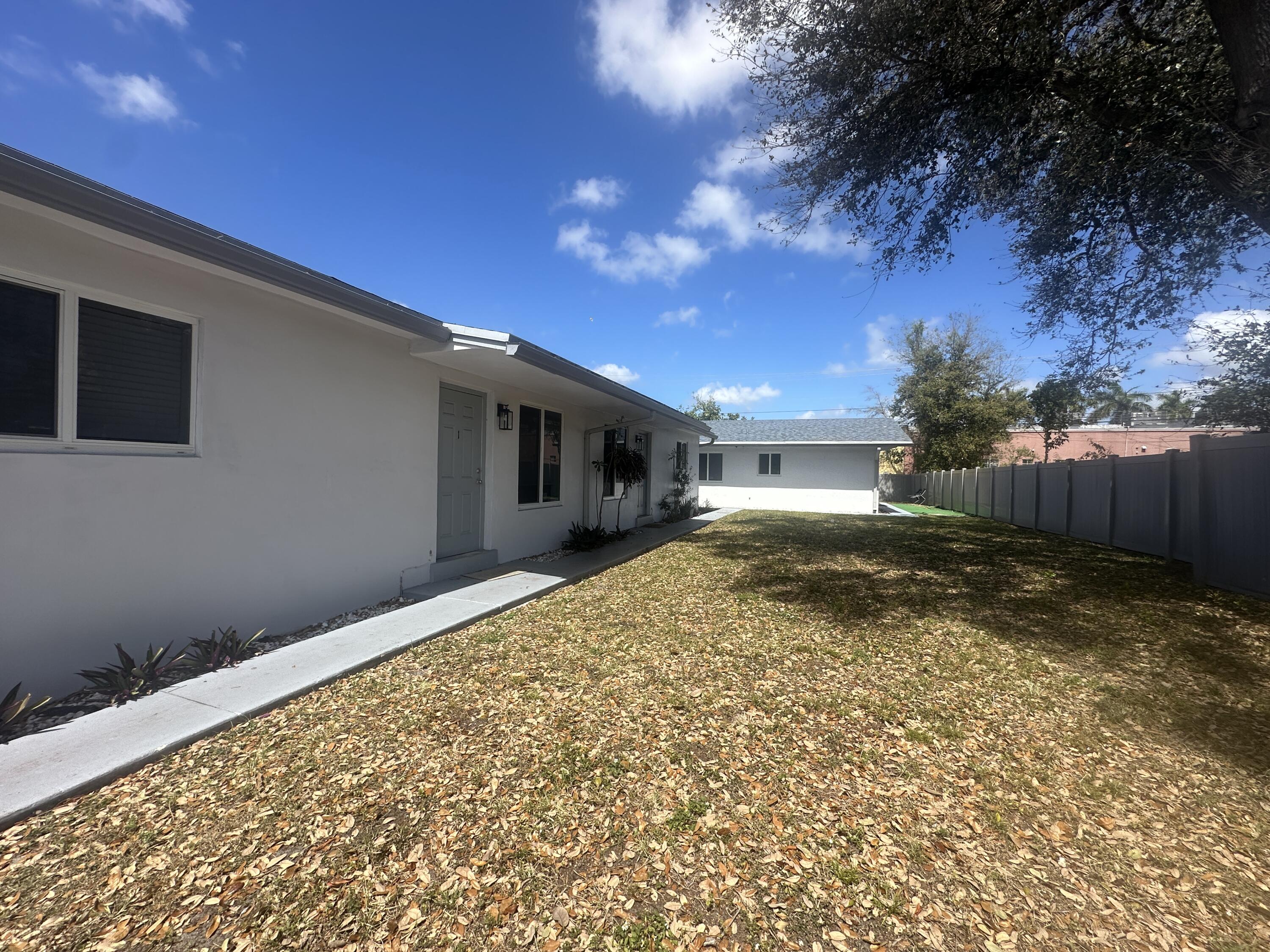 6109 Southwest 30th Street Miramar, FL 33023 - Photo 4 of 22 a view of house with backyard and tree