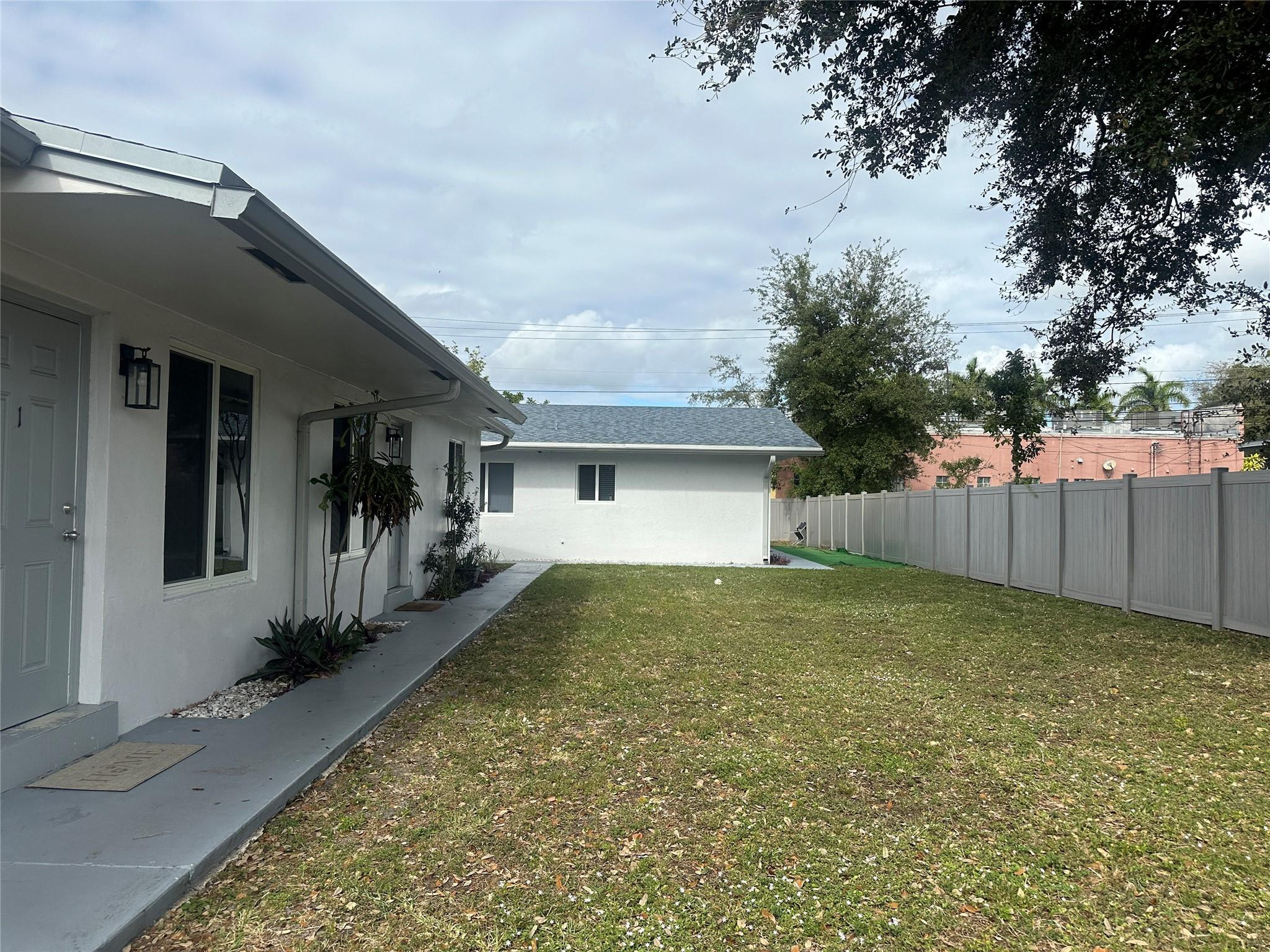 6109 Southwest 30th Street Miramar, FL 33023 - Photo 6 of 22 a view of a house with a yard