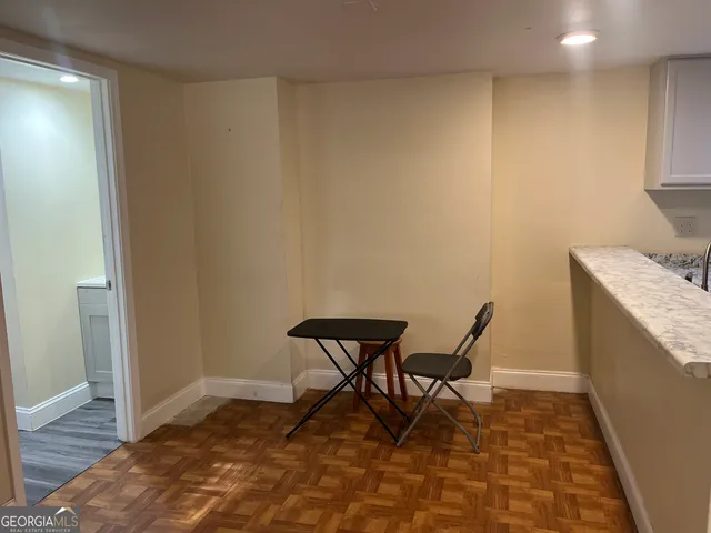 a view of an empty room with a closet
