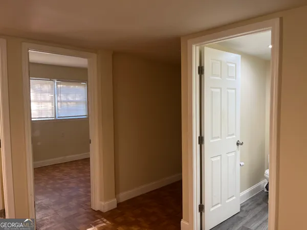 a view of an empty room with a window