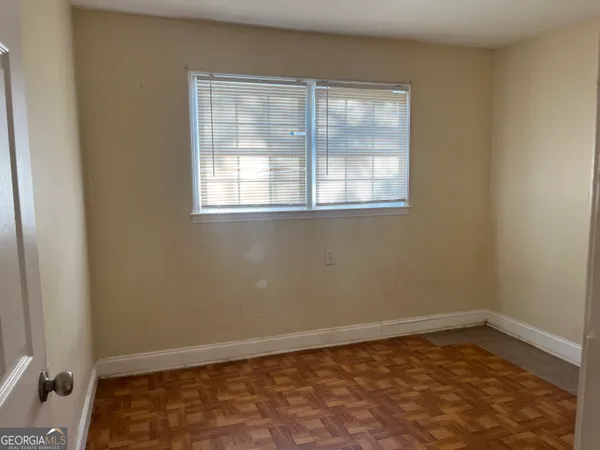 a view of an empty room with a window