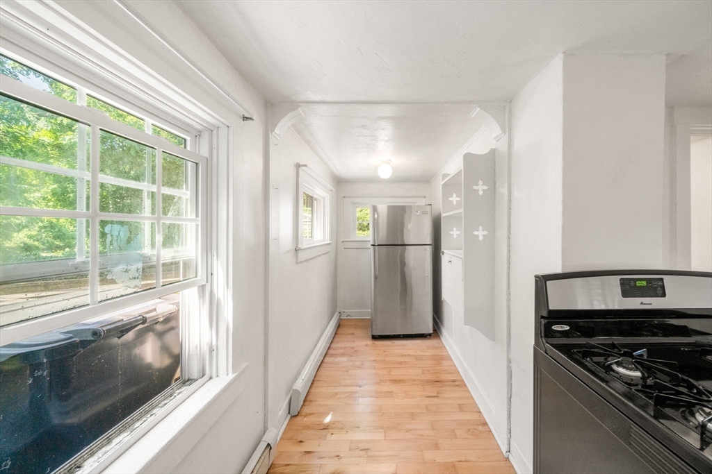 1406 Tucker Road Dartmouth, MA 02747 - Photo 11 of 30 a view of a kitchen with a stove