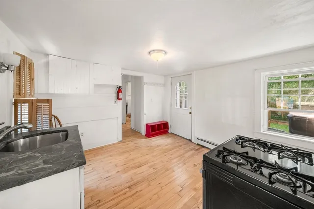 a kitchen with a stove and a sink